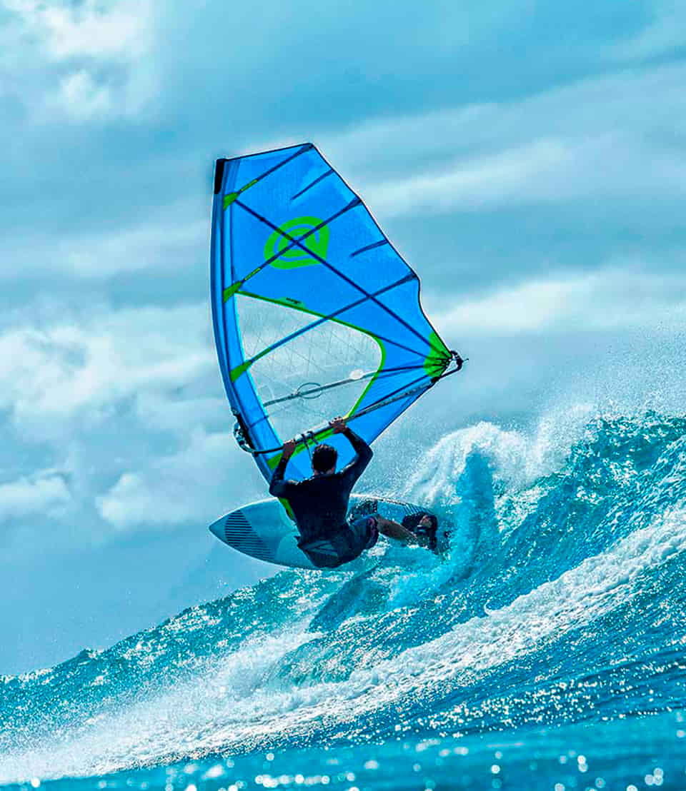 Windsurfer going down a wave